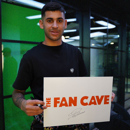 Cristian Romero Signs for The Fan Cave Memorabilia